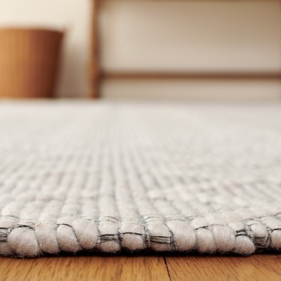 Ivory Hand-Tufted Wool and Synthetic Round Area Rug