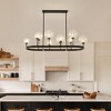 PAKOKULA 10 light Black Rustic Linear lsland Chandelier with Clear Bubble Glass Shade - 4 of 4