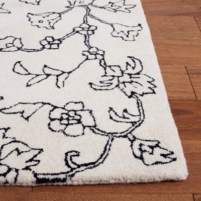 Ivory and Black Floral Hand-Tufted Wool Area Rug 4' x 6'