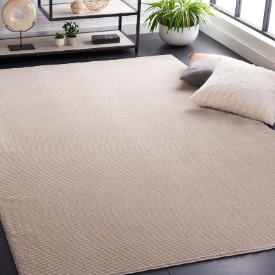 Elegant Beige Synthetic 5'3" x 7'7" Easy-Care Area Rug