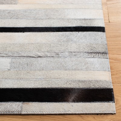 Handmade Black and Ivory Geometric Cowhide Area Rug