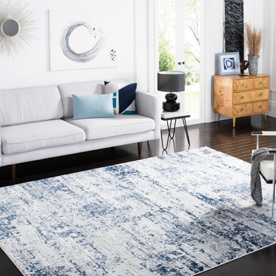 Ivory and Navy Abstract 8' x 10' Synthetic Area Rug