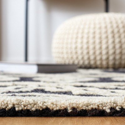 Handmade Black and Ivory Wool Abstract Area Rug
