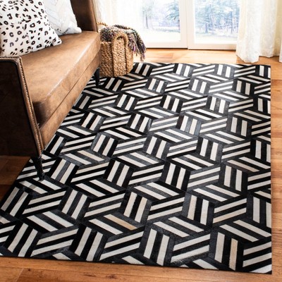 Handmade Black and Ivory Geometric Cowhide Area Rug