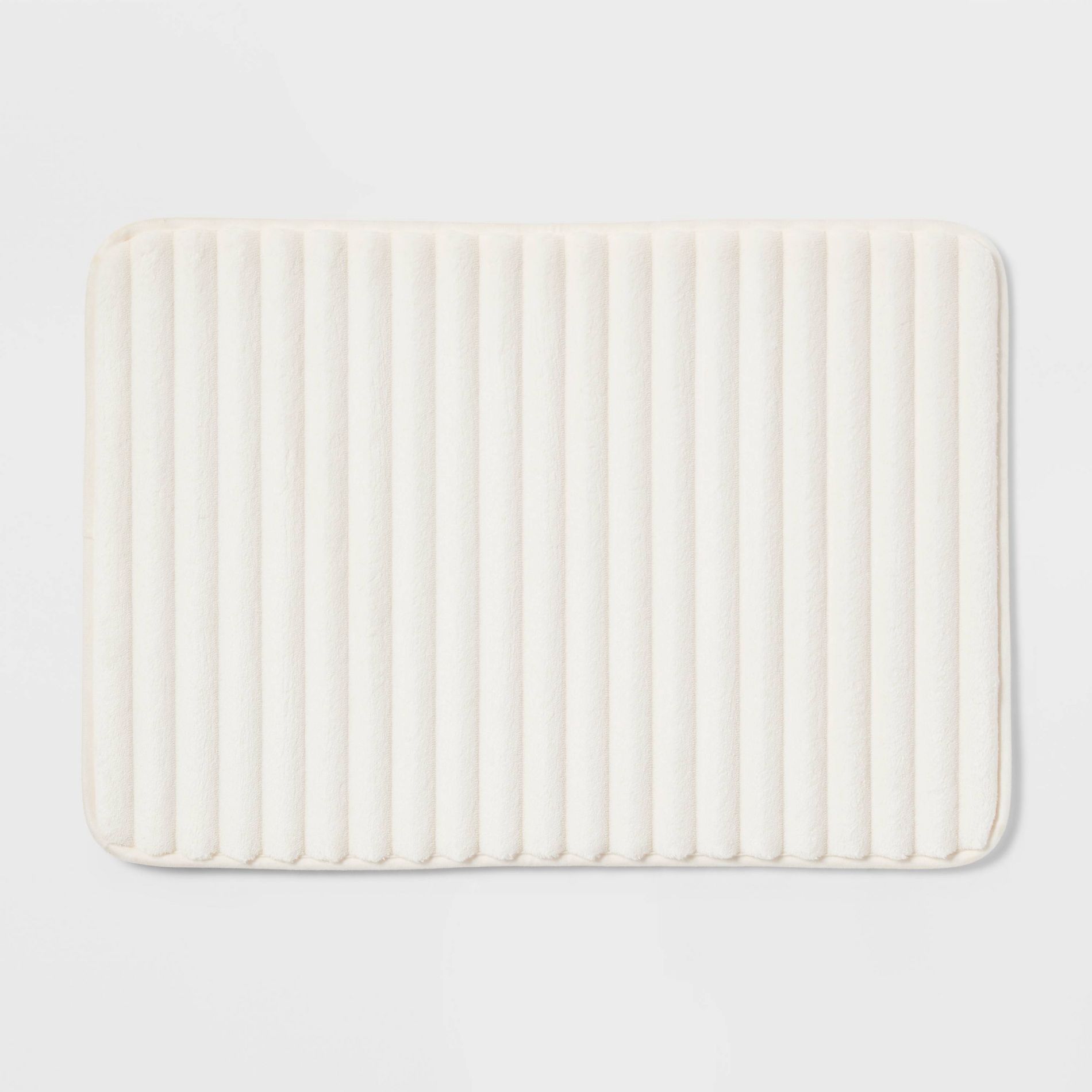 17"x24" Ribbed Cushion Foam Bath Rug Cream - Room Essentials™