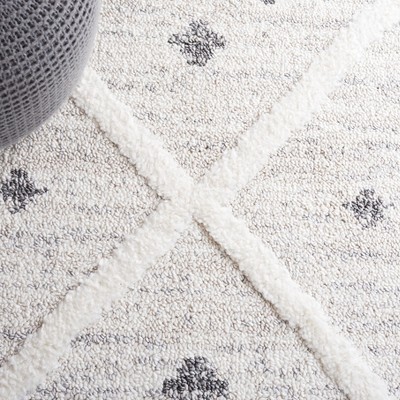 Ivory and Beige Diamond Shag Synthetic Area Rug with Braided Fringe