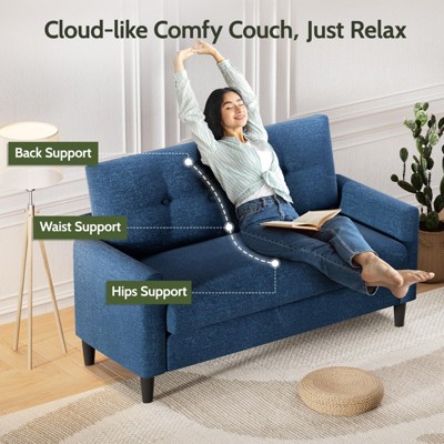 Woman using blue loveseat with labels for back support, waist support, hip support