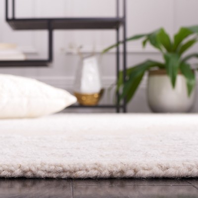 Ivory Abstract Handmade Wool 8' x 10' Area Rug