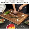 Acacia wood cutting board set (two pieces), including one 20" x 15" board and one 24x 18" board, with drainage channels and handles, reversible. - 3 of 4