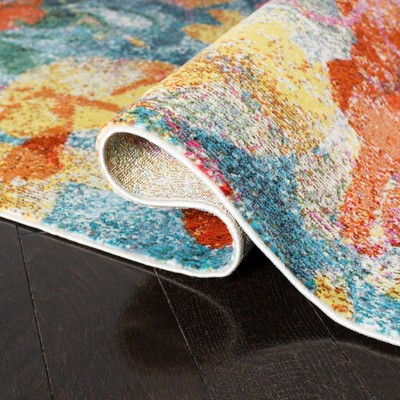 Lillian Blue and Orange Floral Synthetic Area Rug