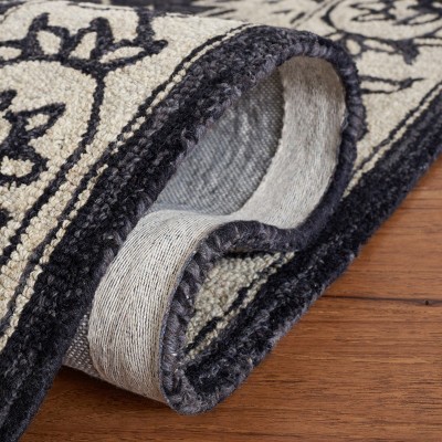 Black and Ivory Floral Wool 8' x 10' Handmade Tufted Rug