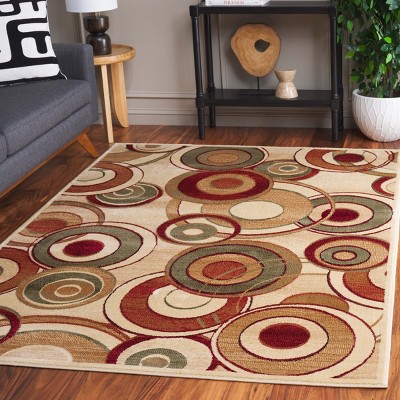 Ivory and Multi 4' x 6' Retro Synthetic Area Rug