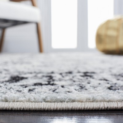 Ivory and Black Rectangular Synthetic Area Rug