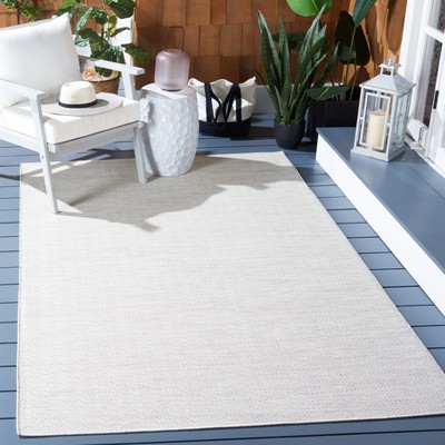 Ivory and Multi 5'1" x 7'6" Synthetic Indoor/Outdoor Area Rug