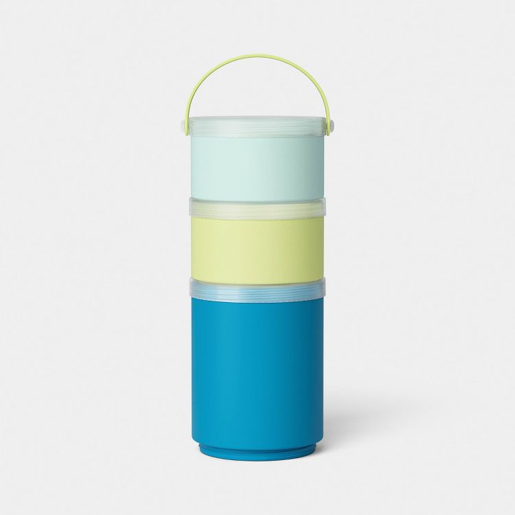Stacked cylindrical containers in light blue, yellow, and blue colored sections with a handle on top.