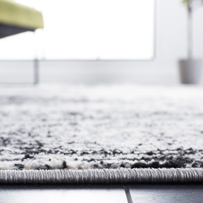 4' x 6' Black Abstract Easy Care Synthetic Rug