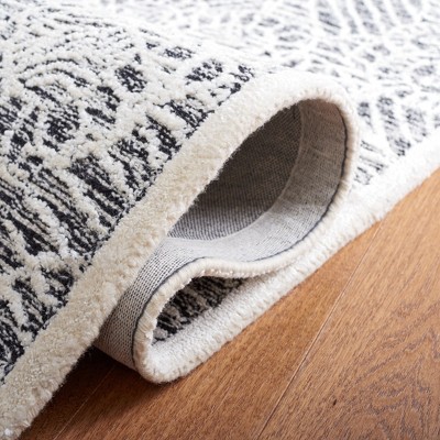 Black and Ivory Hand-Tufted Wool Floral Area Rug