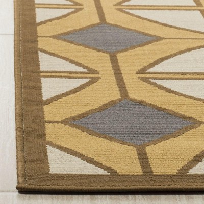 Ivory and Camel Geometric 4' x 6' Synthetic Area Rug