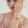 Free bird Cross Birthstone Bracelet | Dainty 14K Gold Plated Cross Charm Bracelet | Stretchable Elastic Gold Beaded Bracelet - 4 of 4