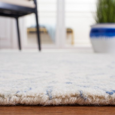 Ivory and Blue Floral Tufted Wool 4' x 6' Area Rug