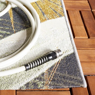 Black and Gold Tropical Synthetic Round Area Rug