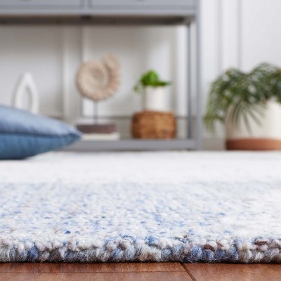 Blue and Ivory Hand Tufted Wool Area Rug 5' x 8'