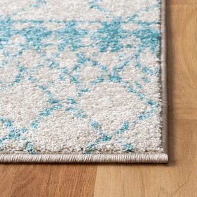 Ivory and Turquoise Hand-knotted Wool 6' x 9' Area Rug