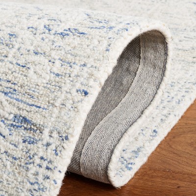 Ivory and Blue Handmade Wool Abstract Tufted Area Rug, 8' x 10'