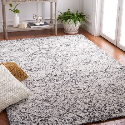 Handmade Black and Ivory Geometric Wool Area Rug