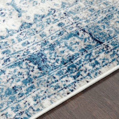 Elegant Sky Blue 9' x 12' Synthetic Stain-Resistant Area Rug