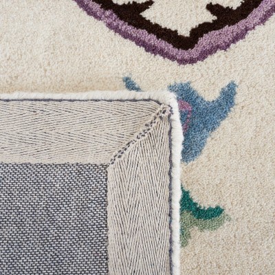 Ivory and Purple Hand Tufted Wool Area Rug