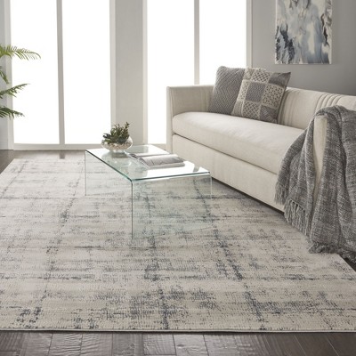 Ivory and Blue Abstract Synthetic 9x13 Area Rug