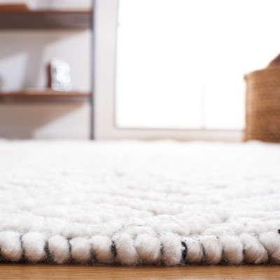 Handmade Black and Ivory Round Tufted Shag Rug