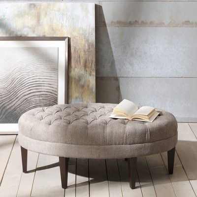 Beige Tufted Oval Ottoman with Dark Wood Legs