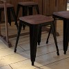 Emma and Oliver Set of Four Table Height Backless Stacking Welded Iron Stools with Wooden Seats and Under Seat Bracing for Indoor Use - 3 of 4