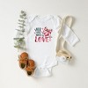 The Juniper Shop All You Need Is Love Coquette Baby Long Sleeve Bodysuit - 2 of 3