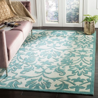 Ivory and Light Blue Hand-Tufted Synthetic 4' x 6' Area Rug