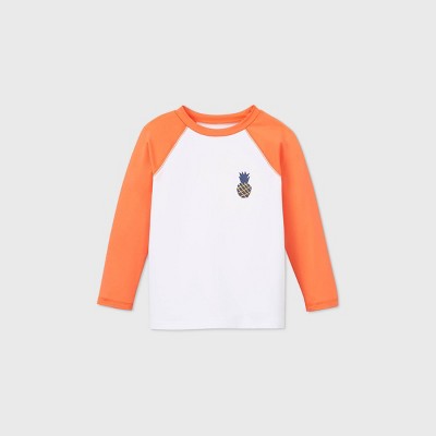 orange and white raglan shirt