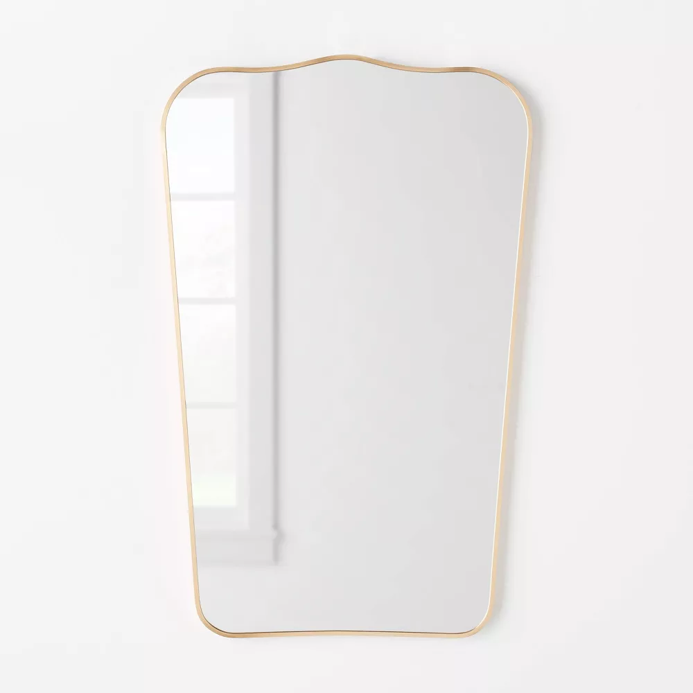 curved gold mirror
