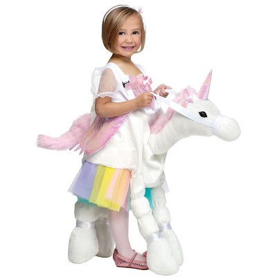 toddler riding unicorn