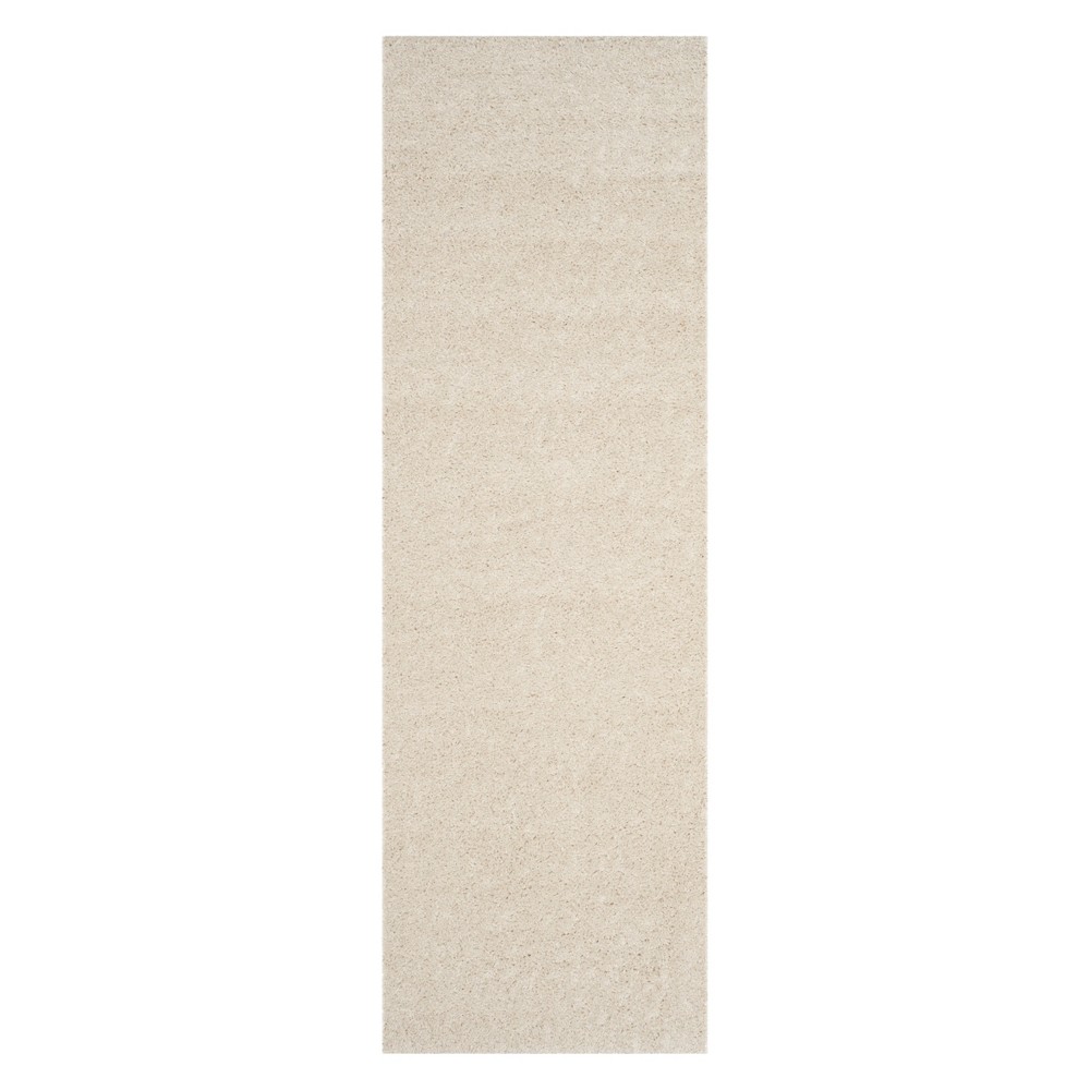 2'3inx12' Runner Solid Cream - Safavieh