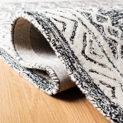Handmade Abstract Black and Ivory Wool Round Rug 6'