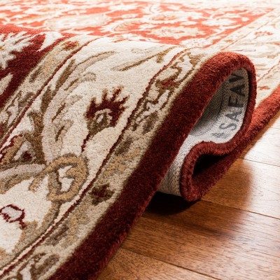 Handmade Red and Ivory Tufted Wool Area Rug