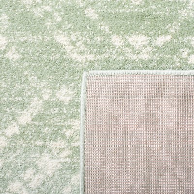 Adirondack Green and Ivory Geometric 6' x 9' Synthetic Rug