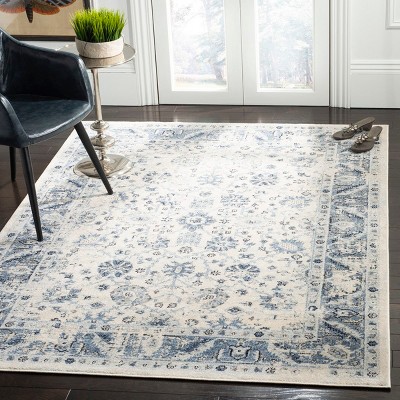 Ivory and Blue 9' x 12' Synthetic Stain-Resistant Area Rug