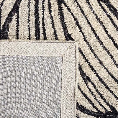 Elegant Noir Hand-Tufted Wool Area Rug, 4' x 6', Black and Ivory