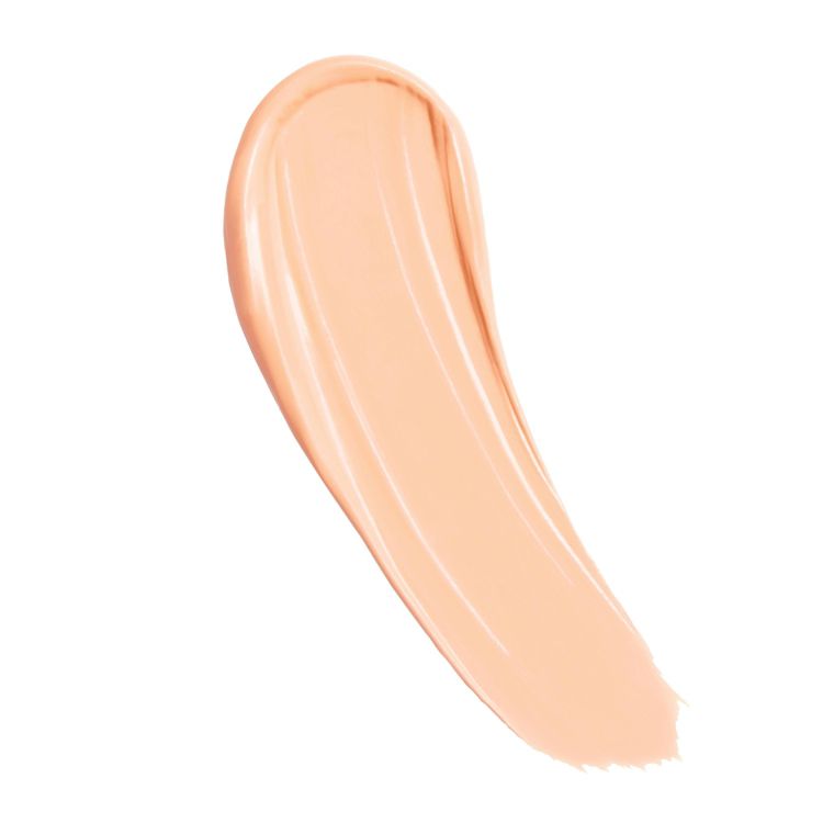 A swatch of light beige concealer with a smooth, creamy texture.