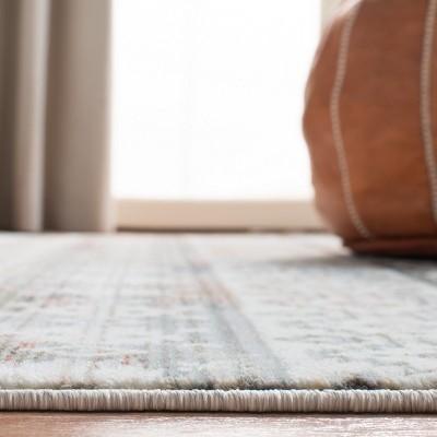 Elegant Ivory Oriental 4' x 6' Synthetic Area Rug