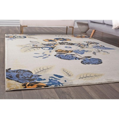 9' x 12' Blue and Ivory Floral Synthetic Area Rug