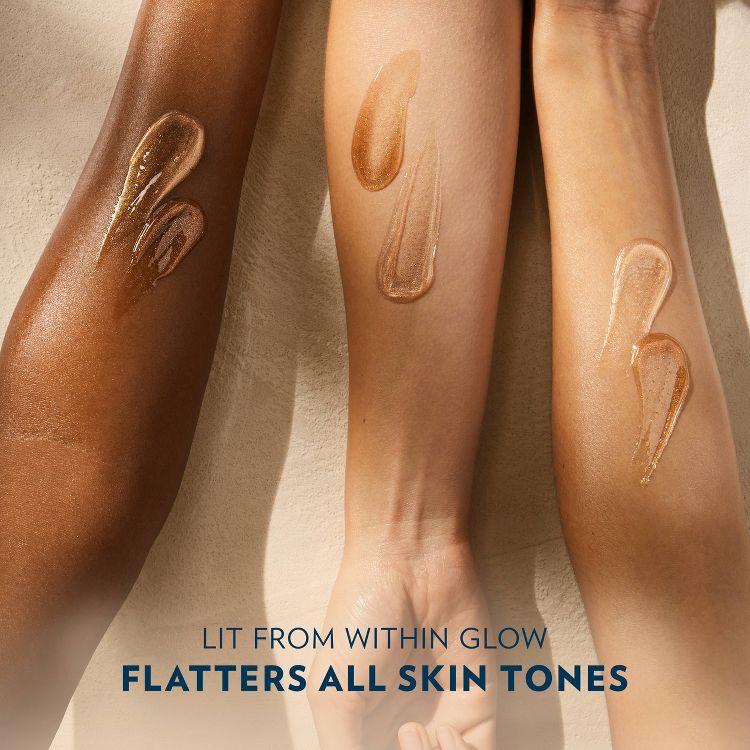 Text reads: "Lit From Within Glow, Flatters All Skin Tones." Three arms with different skin tones showcasing the product's luminous, inclusive appeal.